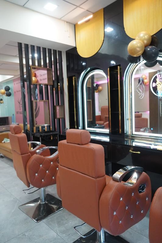 Styling stations with arched, lit mirrors at My Salon